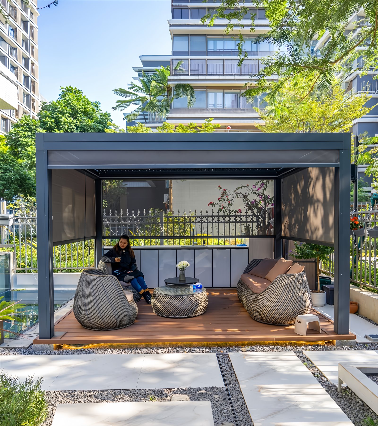 Three by four metre freestanding louvered pergola with roller blinds and lounge furniture