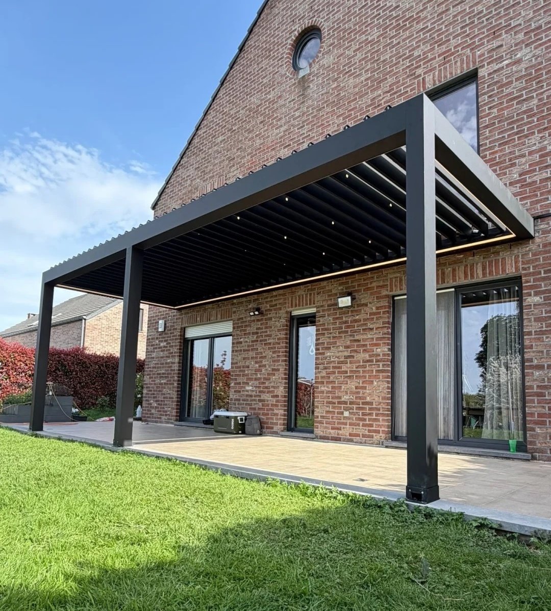 Dark wall-mounted louvered pergola connected to a brick house