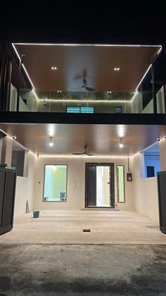 Two-level fixed-roof aluminum canopy with lighting at night