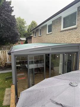 Glazed roof and aluminum frame of a completed Canadian sunroom