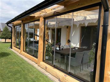 Completed glazed garden sunroom with timber structure in Poland