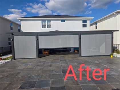 Completed fixed-roof aluminum pergola with light grey roller blinds